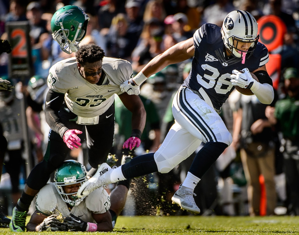 Trent Nelson  |  The Salt Lake TribuneBrigham Young Cougars running back Francis Bernard (36) runs away from Wagner Seahawks linebacker Stephon Font-Toomer (33) as BYU hosts Wagner, NCAA football at LaVell Edwards Stadium in Provo, Saturday October 24, 2015.