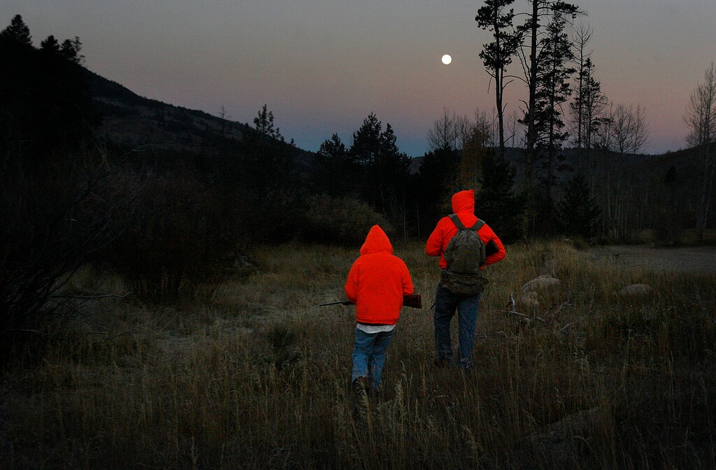 Scott Sommerdorf   |  The Salt Lake TribuneTwelve year old Grayden Larson and his father Aaron of Bluffdale head out on their first hunting trip together as they hunt near Soapstone Basin just off the Mirror Lake Highway, early Saturday morning, October 19, 2013.