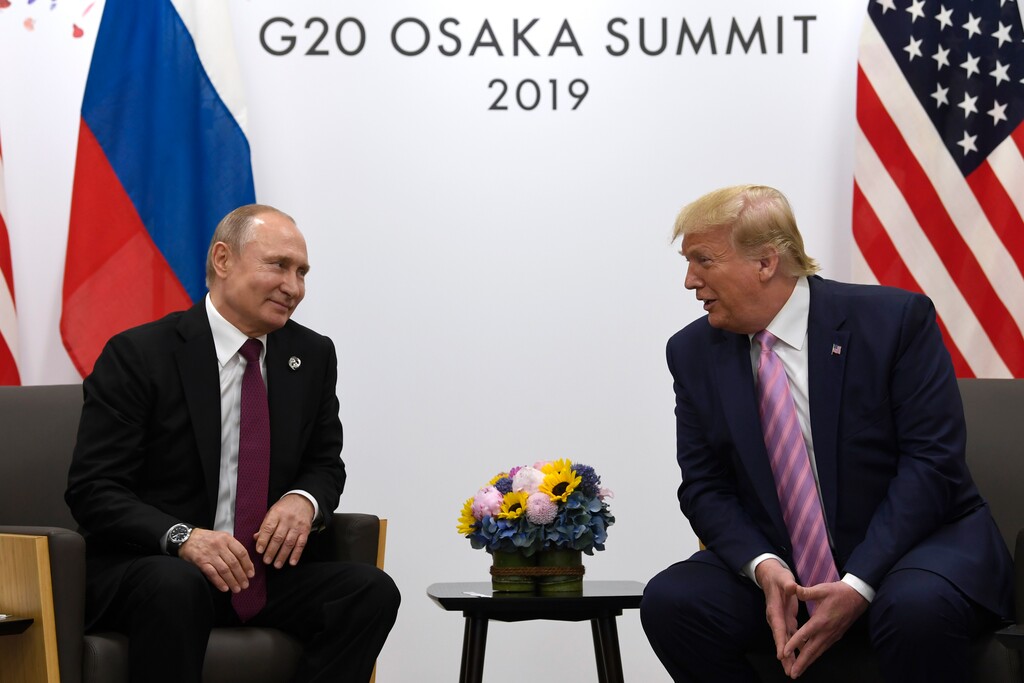 In this June 28, 2019, file photo, President Donald Trump, right, meets with Russian President Vladimir Putin during a bilateral meeting on the sidelines of the G-20 summit in Osaka, Japan. (AP Photo/Susan Walsh, File)