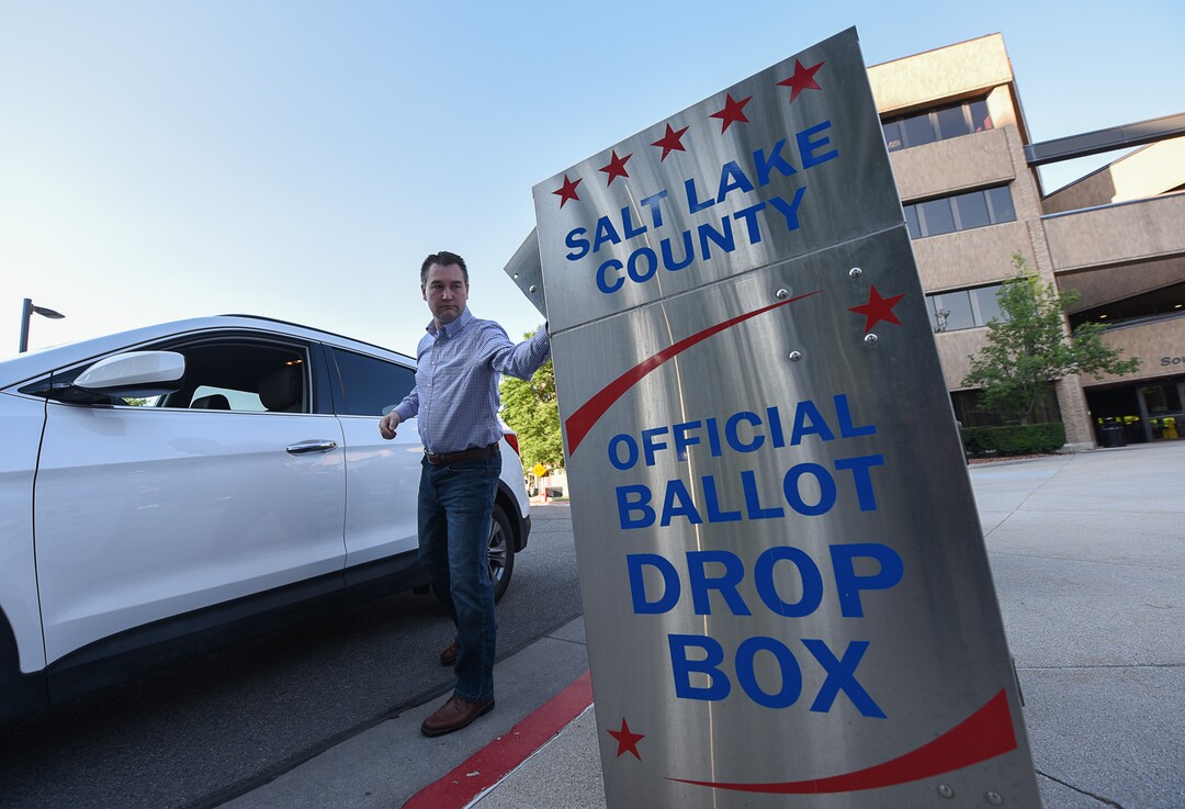 (Francisco Kjolseth  |  The Salt Lake Tribune)  Oliver Hansen drops off his ballot in the official ballot drop box at the Salt Lake County complex for primary election day on Tuesday, June 26, 2018.