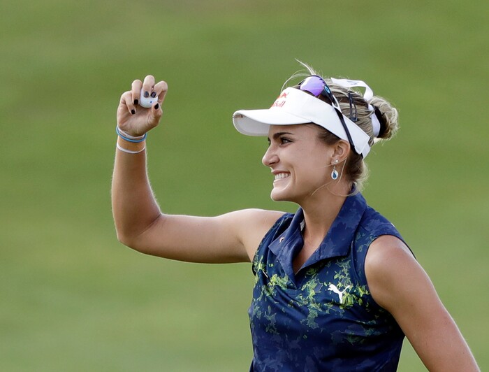 Lexi Thompson waves after winning the Indy Women in Tech Championship golf tournament, Saturday, Sept. 9, 2017, in Indianapolis. (AP Photo/Darron Cummings)