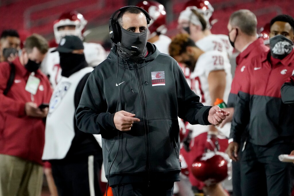 Washington State head coach Nick Rolovich walks the sideline during the second half of an NCAA college football game against Southern California in Los Angeles, Sunday, Dec. 6, 2020. (AP Photo/Alex Gallardo)