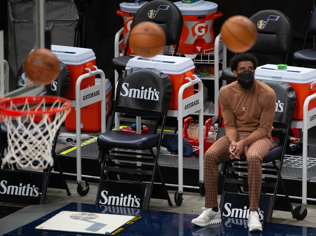 (Francisco Kjolseth  | The Salt Lake Tribune) Injured Utah Jazz guard Mike Conley (10) watches his team warm up from the sidelines as the Utah Jazz get ready to take on the Milwaukee Bucks at Vivint Smart Home Arena in Salt Lake City, on Friday, Feb. 12, 2021.