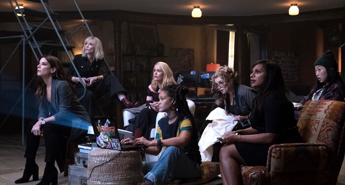 (Barry Wetcher  |  Warner Bros. Pictures) Debbie Ocean (Sandra Bullock, far left) briefs her crew (played by, from left to right, Cate Blanchett, Sarah Paulson, Rihanna, Helena Bonham Carter, Mindy Kaling and Awkwafina) on a heist plan, in the caper comedy "Ocean's 8," opening nationwide on June 8, 2018.