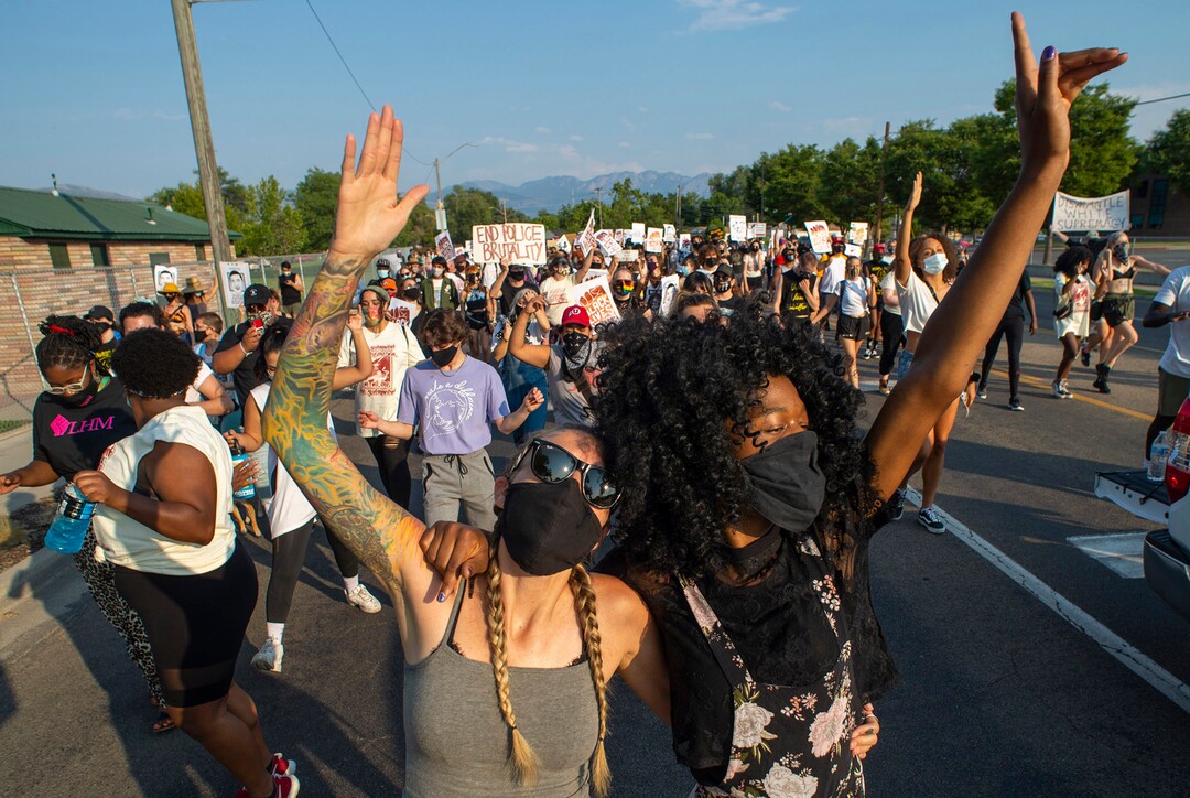 (Rick Egan  |  The Salt Lake Tribune)     Protesters dance through the neighborhood in Rose Park, during the Dance Dance for Revolution protest for racial equality, on Sunday, Aug. 23, 2020. The protest was in memory of Jovany Mercardo who was shot last August by Ogden police by four officers, hitting his body sixteen times.