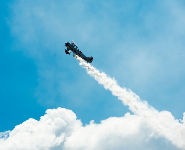 (Rick Egan  |  The Salt Lake Tribune)    Gary Rower performs in his 1941 Stearman, at the Warriors Over the Wasatch airshow at Hill Airforce Base, Sunday, June 24, 2018.