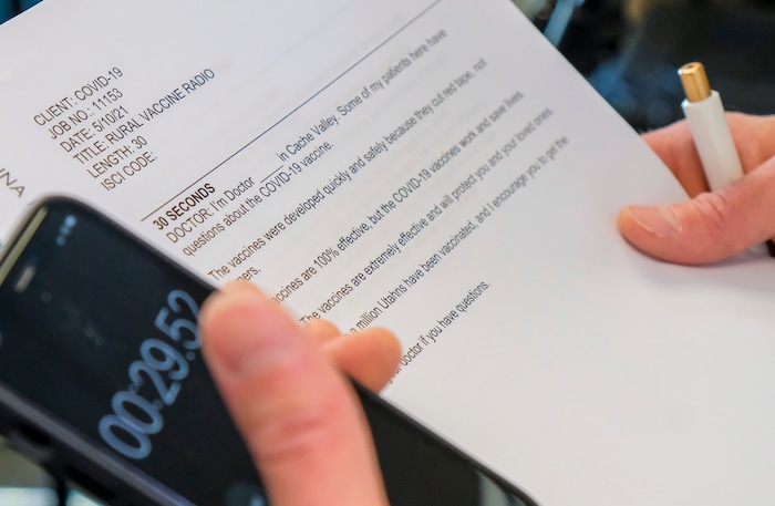 (Leah Hogsten | The Salt Lake Tribune)  The script that Dr. Edward Redd with the Bear River Health Department reads as he is filmed by two filmakers with Penna Powers ad agency May 11, 2021 for public service announcements to encourage Utahns to get the COVID-19 vaccine.