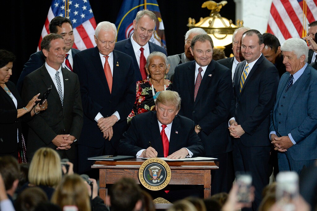 President Donald Trump is surrounded by Utah representatives at the Utah Capitol on Monday, Dec. 4, 2017, as he signs two presidential proclamations to shrink Bears Ears and Grand Staircase-Escalante national monuments.  (Francisco Kjolseth/The Salt Lake Tribune via AP)