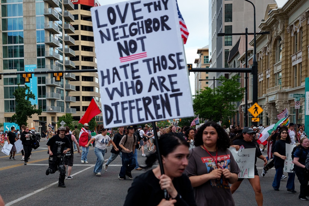 (Trent Nelson | The Salt Lake Tribune) People run from the scene of a reported shooting during a protest march in Salt Lake City, Saturday, June 14, 2025.