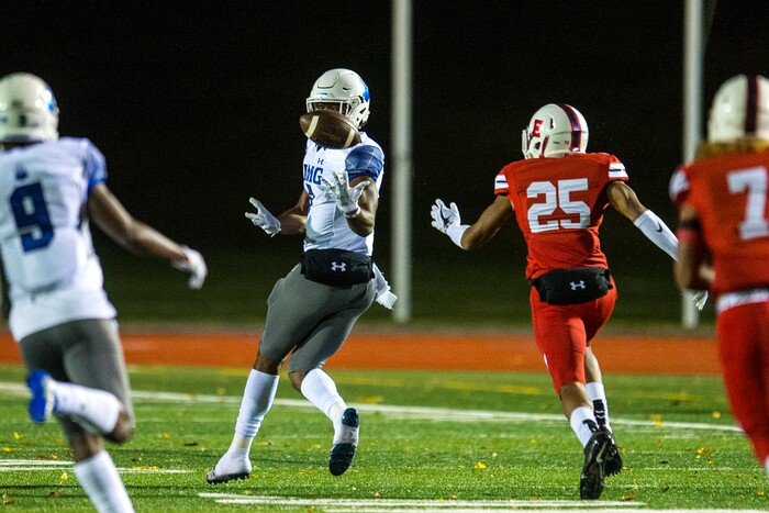 (Chris Detrick  |  The Salt Lake Tribune)  IMG Academy's Brian Hightower (7) makes a catch past East's Christian Nash (25) during the game at East High School Friday, October 20, 2017. 