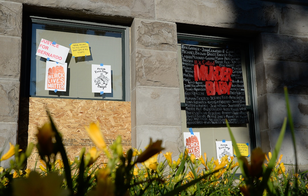 (Francisco Kjolseth  |  The Salt Lake Tribune) A sign placed on City Hall in Salt Lake City reads "It's Murder Baby," as people celebrate Juneteenth at Washington Square on Friday, June 19, 2020.