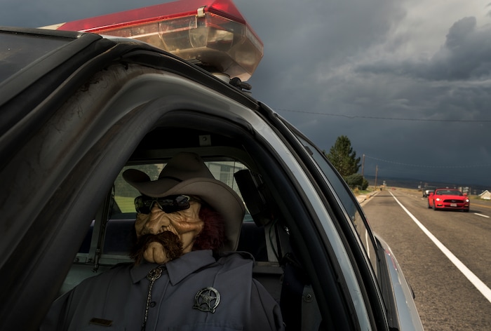 (Leah Hogsten  |  The Salt Lake Tribune) Parked on the shoulder of Highway 24, Wayne County sheriff's "deputy" Parker Doolittle deters would be speeders in the small town of Loa, Utah, Sept. 13, 2017.