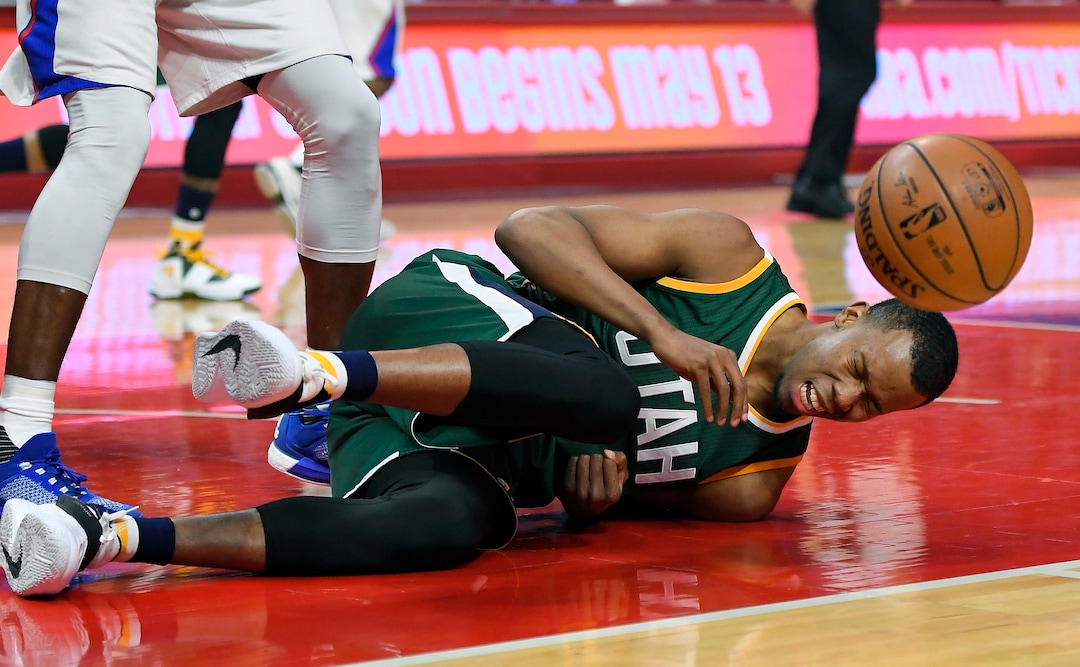 Utah Jazz guard Rodney Hood goes down hard after trying to shoot as Los Angeles Clippers center DeAndre Jordan defended during the first half in Game 5 of an NBA basketball first-round playoff series, Tuesday, April 25, 2017, in Los Angeles. (AP Photo/Mark J. Terrill)