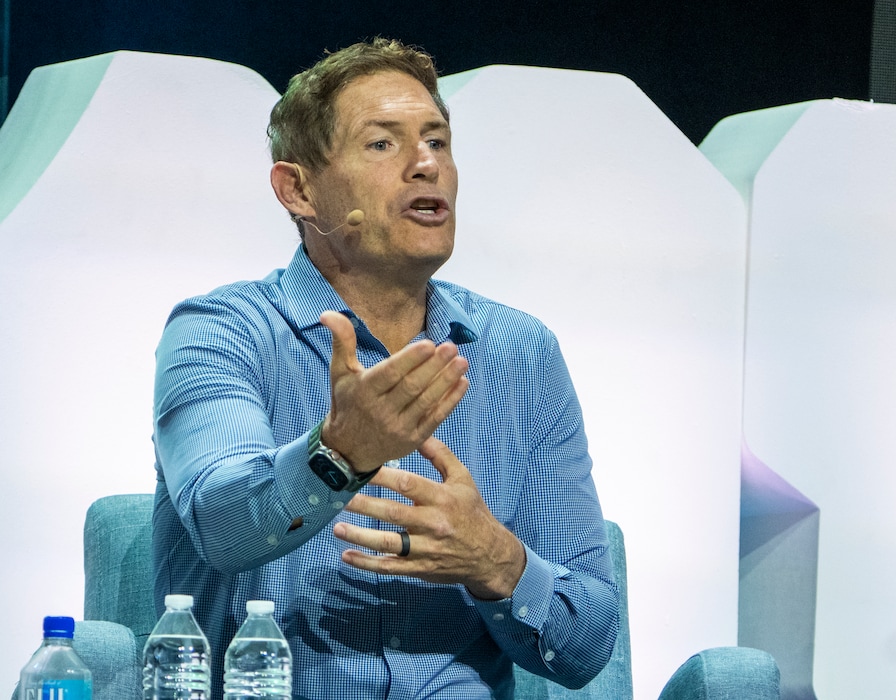 (Rick Egan | The Salt Lake Tribune) Steve Young speaks at the Silicon Slopes Summit in 2022. His new book is titled "The Law of Love."