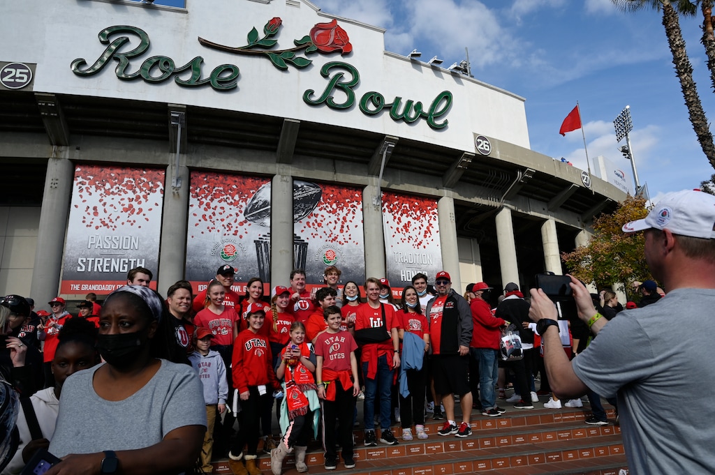 (John McCoy | AP) Fans pose for photos before the Rose Bowl NCAA college football game between Utah and Ohio State Saturday, Jan. 1, 2022, in Pasadena, Calif.