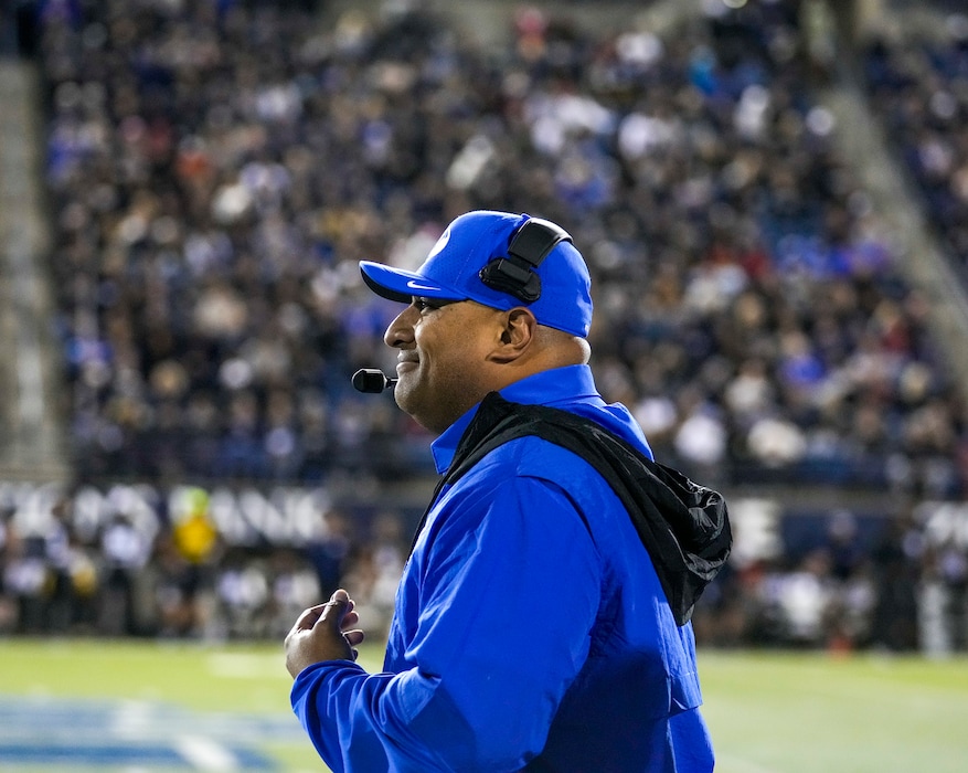 (Leah Hogsten | The Salt Lake Tribune) Brigham Young Cougars head coach Kalani Sitake celebrates the win as the Utah State Aggies host Brigham Young University Cougars at Maverik Stadium Oct. 1, 2021. The Cougars attempt a second straight win for the Wagon Wheel, the trophy of the in-state rivalry, while the Aggies will try to recapture the trophy.