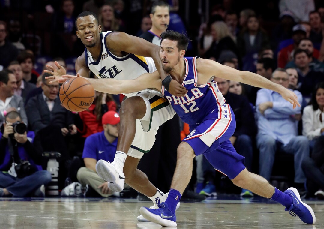 Philadelphia 76ers' T.J. McConnell, right, steals the ball away from Utah Jazz's Rodney Hood during the first half of an NBA basketball game, Monday, Nov. 20, 2017, in Philadelphia. (AP Photo/Matt Slocum)
