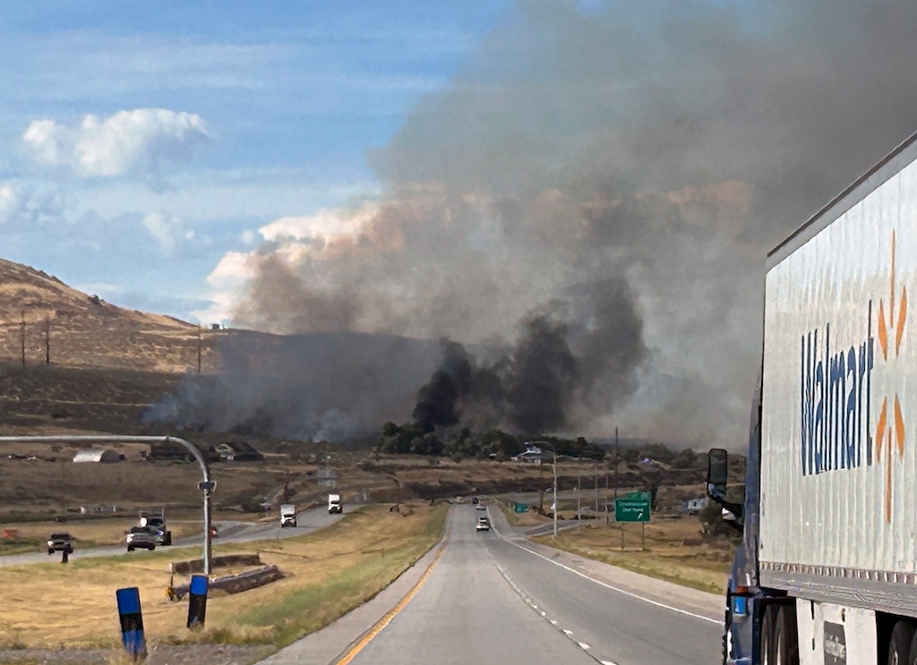 (Kyle Hansen | The Salt Lake Tribune) The Harley Fire burns along Interstate 15 north of Tremonton, Friday, Aug. 21, 2026.