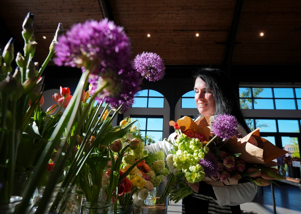 (Bethany Baker  |  The Salt Lake Tribune) Stacie Bersie, the owner of Deer Haven Ribbons and Blooms, shops for flowers at the Utah Flower Market in Pleasant Grove on Wednesday, May 7, 2025.