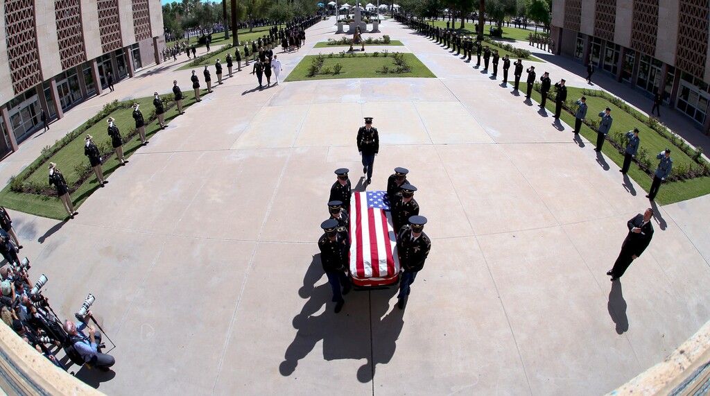 (Rob Schumacher | The Arizona Republic | The Associated Press) The Arizona National Guard carries the casket of Sen. John McCain, R-Ariz., into a memorial service at the Arizona Capitol on Wednesday, Aug. 29, 2018, in Phoenix.