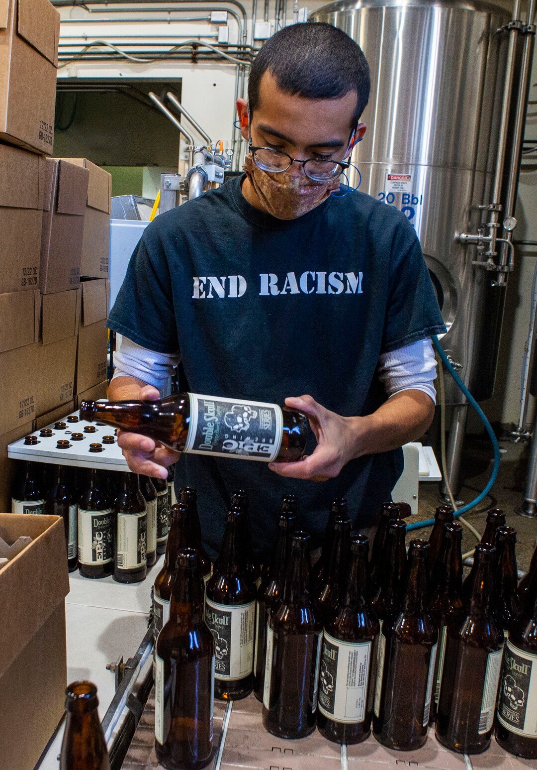 (Rick Egan  |  The Salt Lake Tribune)    Jordan Vigil loads bottles in the brewery at Epic Brewing Co. in Salt Lake City, Thursday, Oct. 29, 2020.