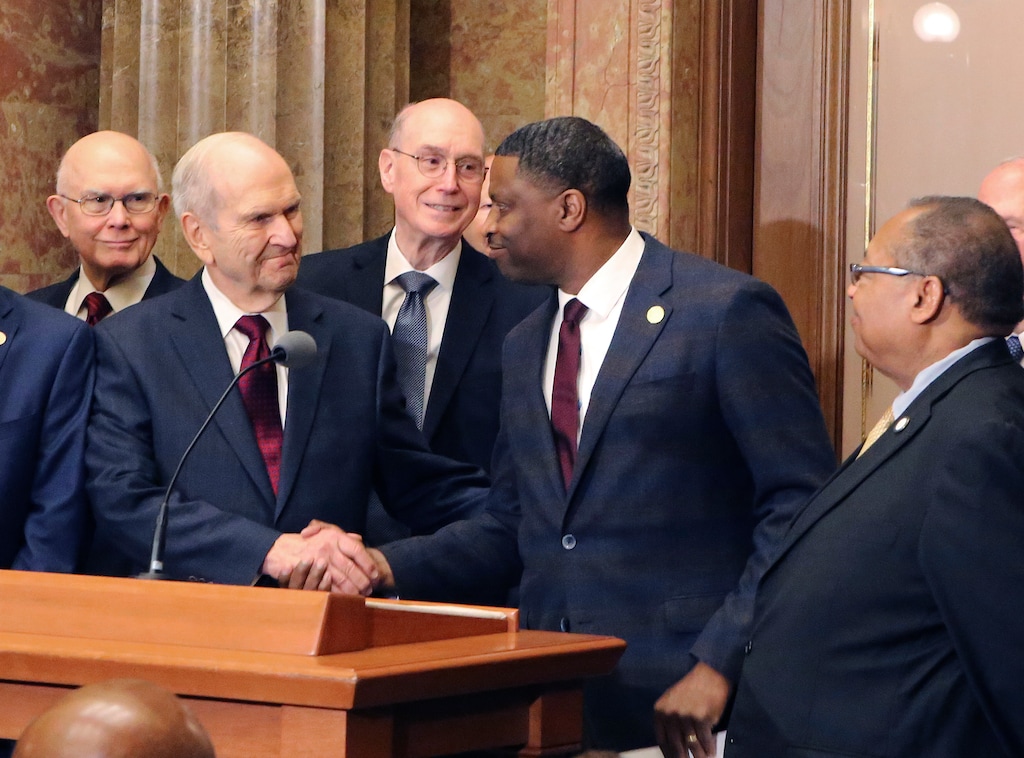 (Rick Bowmer | AP) Then-church President Russell M. Nelson shakes hands with Derrick Johnson, president of the NAACP, in 2018. Johnson is eager to speak with Nelson's successor, Dallin Oaks, far left.