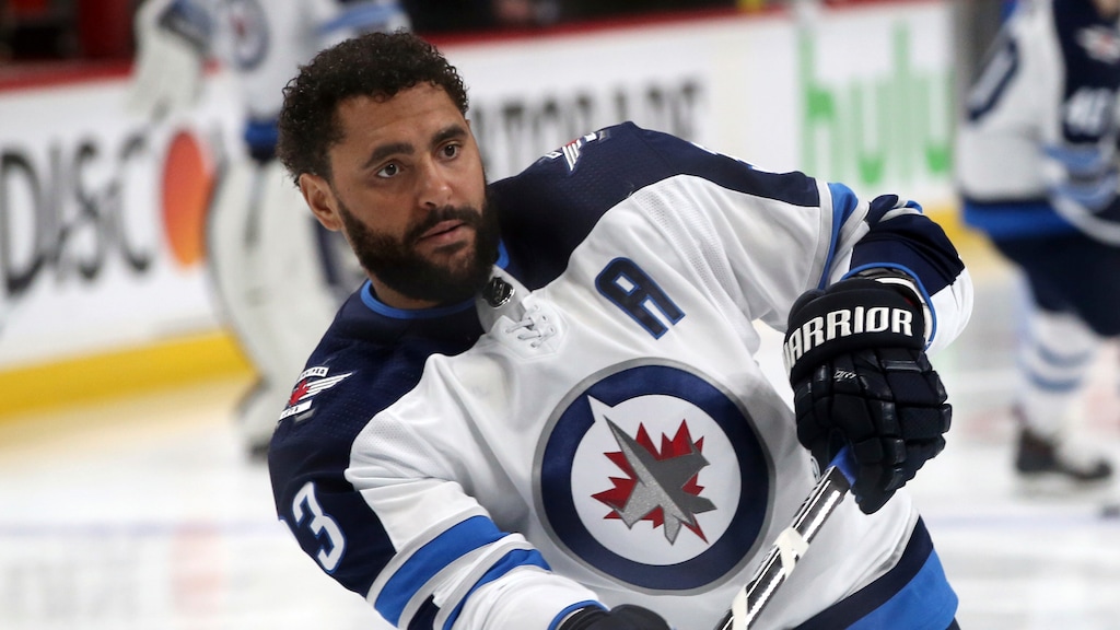 FLE - In this April 17, 2018, file photo, Winnipeg Jets' Dustin Byfuglien warms up before Game 4 of an NHL hockey first-round playoff series against the Minnesota Wild in St. Paul, Minn. The Winnipeg Jets and Dustin Byfuglien have agreed to mutually terminate his contract after a lengthy dispute. (AP Photo/Jim Mone, File)