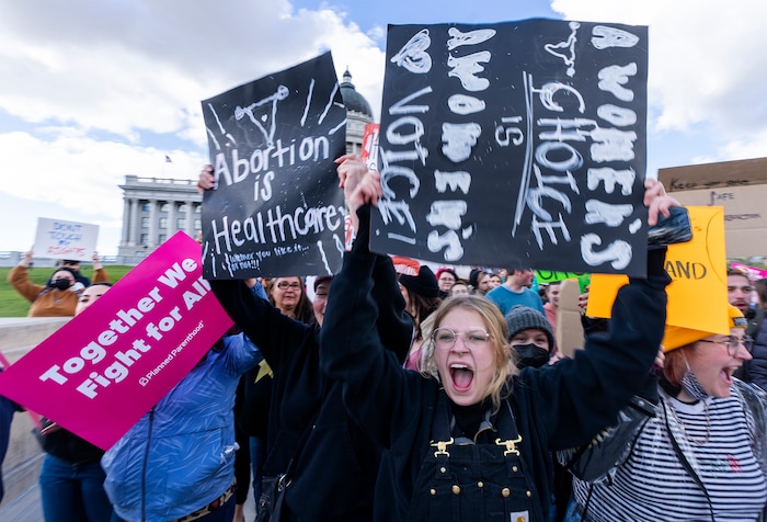 (Rick Egan | The Salt Lake Tribune) Hundreds of protesters march down State Street after a bans off our bodies protest hosted by Planned Parenthood, on Tuesday, May 3, 2022.
