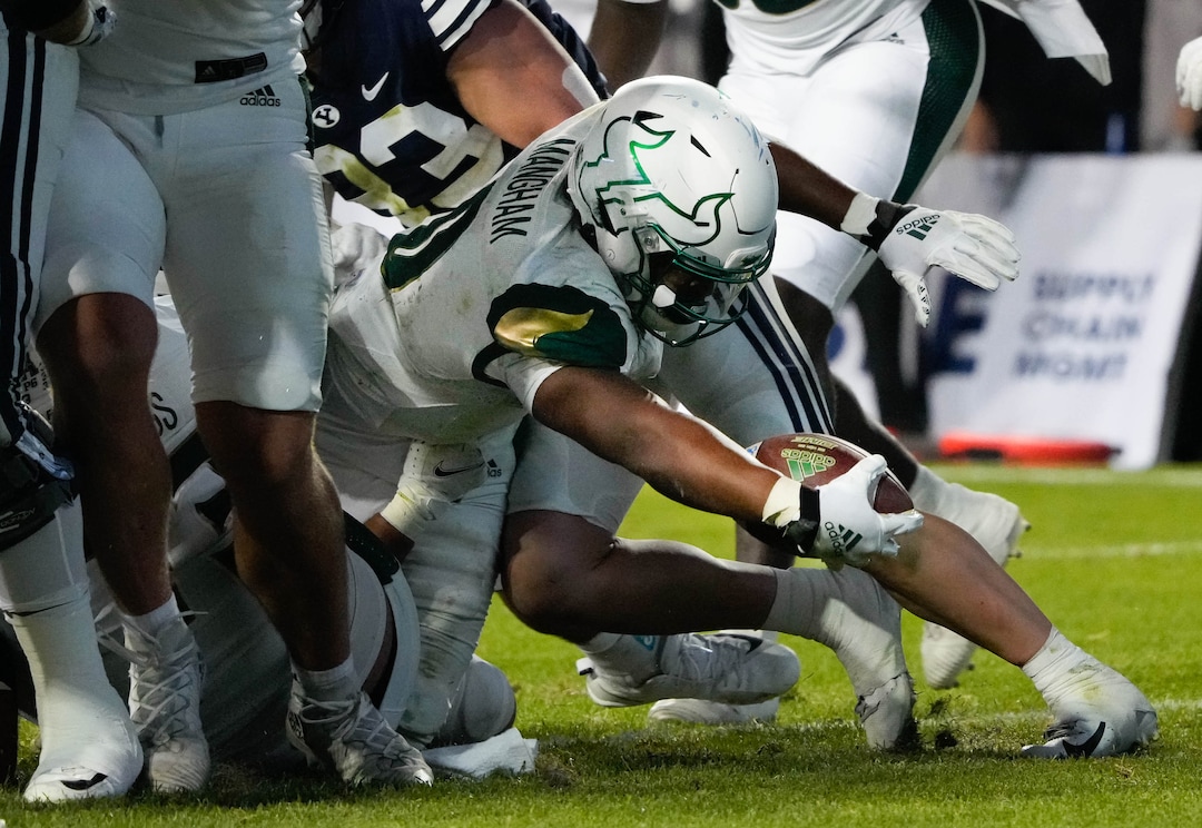 (Francisco Kjolseth | The Salt Lake Tribune) South Florida Bulls running back Jaren Mangham (0) pushes the ball over the line for a touchdown in the final minutes of game action between the Brigham Young Cougars and the South Florida Bulls at LaVell Edwards Stadium in Provo, Saturday, Sept. 25, 2021.