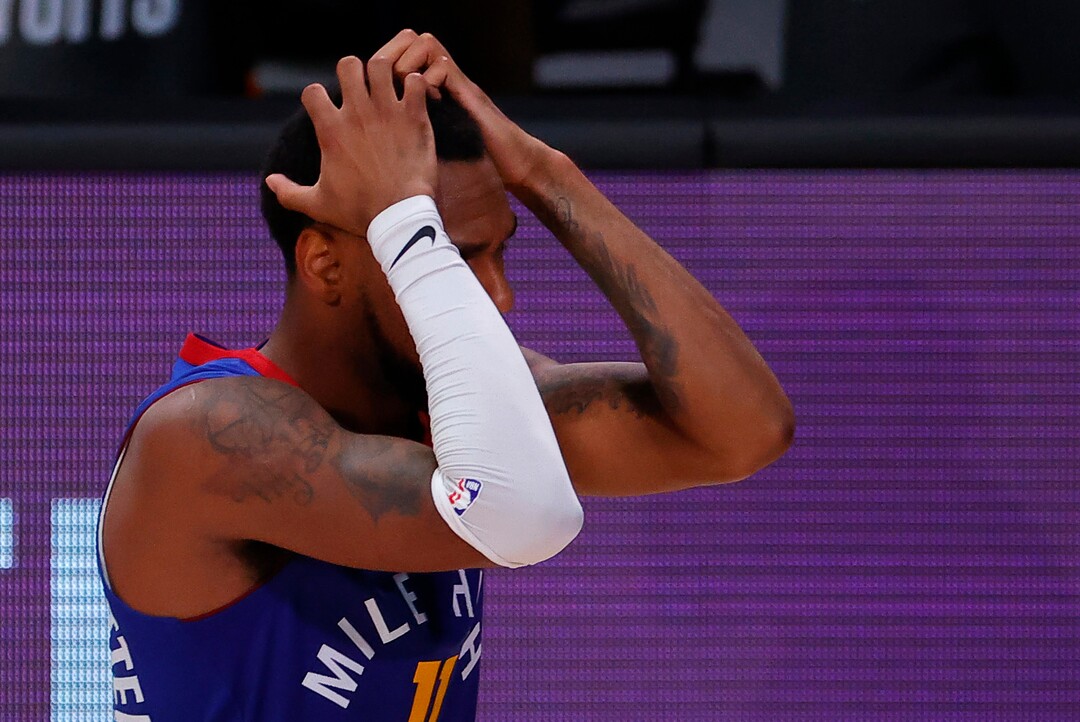 Denver Nuggets' Monte Morris reacts after being charged with a foul against the Utah Jazz during the third quarter in Game 4 of an NBA basketball first-round playoff series, Sunday, Aug. 23, 2020, in Lake Buena Vista, Fla. (Kevin C. Cox/Pool Photo via AP)
