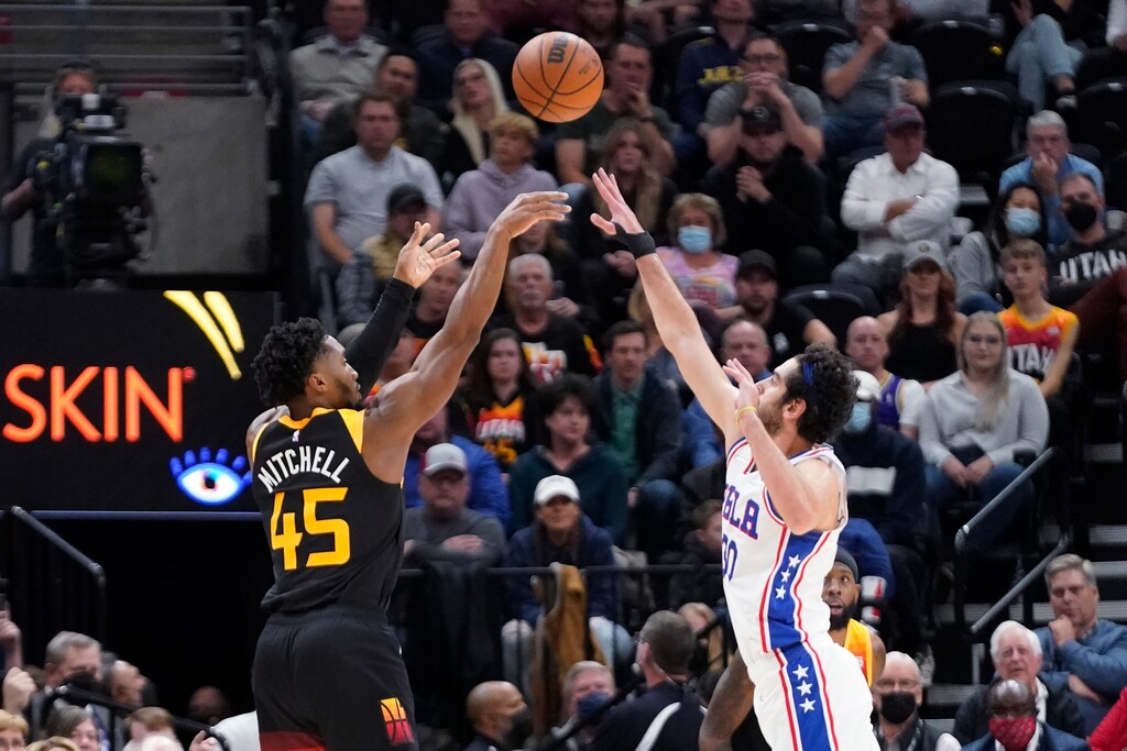 (Rick Bowmer | AP) Utah Jazz guard Donovan Mitchell (45) shoots as Philadelphia 76ers guard Furkan Korkmaz defends during the first half of an NBA basketball game Tuesday, Nov. 16, 2021, in Salt Lake City.