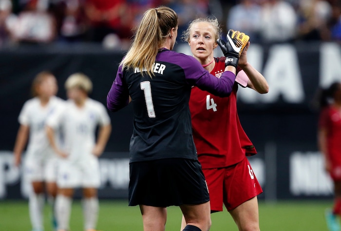 U.S. goalie Alyssa Naeher (1) is congratulated by defender Becky Sauerbrunn (4) after an international friendly women's soccer match against South Korea in New Orleans, Thursday, Oct. 19, 2017. The United States won 3-1. (AP Photo/Gerald Herbert)