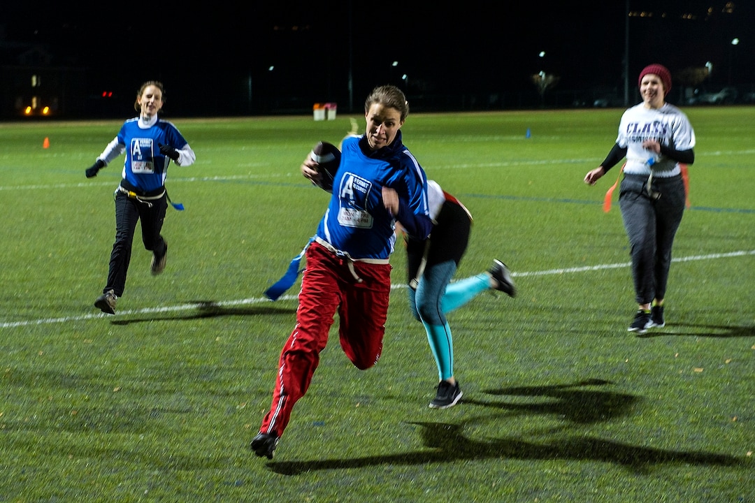 (Chris Detrick  |  The Salt Lake Tribune) Team A Lot quarterback Jenn Hartman runs the ball during the flag football team game against Sim Team at North University Fields in Provo Thursday, November 30, 2017.  