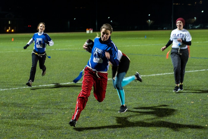 (Chris Detrick | The Salt Lake Tribune) Team A Lot quarterback Jenn Hartman runs the ball during the flag football team game against Sim Team at North University Fields in Provo Thursday, November 30, 2017.