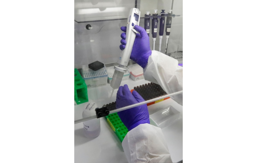 A Co-Diagnostics lab technician manufactures COVID-19 testing kits Friday, March 27, 2020, in Salt Lake City. The company says it has the capacity to produce 50,000 test kits daily from its Salt Lake City facility. (AP Photo/Rick Bowmer)