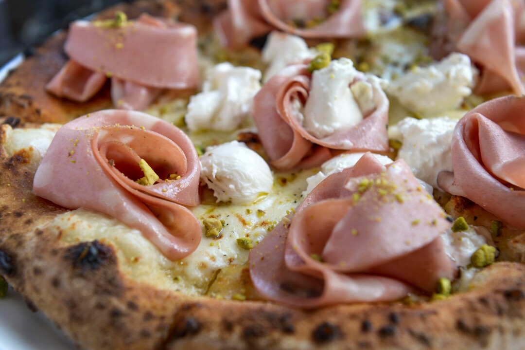 (Leah Hogsten  |  The Salt Lake Tribune) Pizza Marco with burrata, mortadella, ground pistachio, lemon zest and extra virgin olive oil, $20 at Osteria Amore, serving traditional flavors of Italy with a modern spin, Jan. 10, 2020.