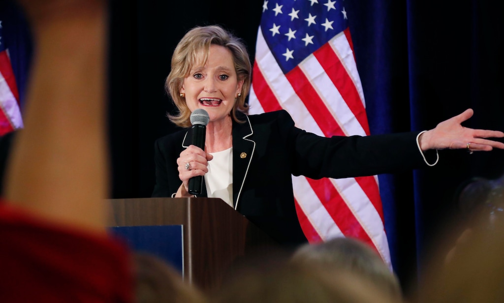 Republican U.S. Sen. Cindy Hyde-Smith calls on her family members to identify themselves as she celebrates her runoff win over Democrat Mike Espy in Jackson, Miss., Tuesday, Nov. 27, 2018. Hyde-Smith will now serve the final two years of retired Republican Sen. Thad Cochran's six year term. (AP Photo/Rogelio V. Solis)
