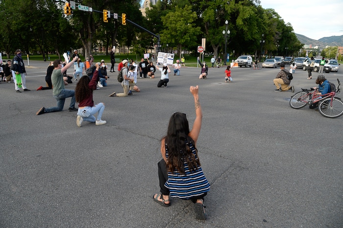 (Francisco Kjolseth  |  The Salt Lake Tribune) Demonstrators temporarily block traffic at 500 S. and State street in Salt Lake City during a Justice for Bernardo Palacios Rally, on Thursday, June 18, 2020.