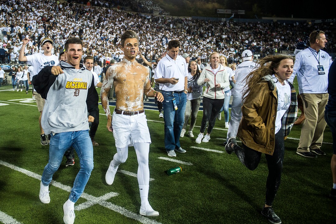 (Chris Detrick  |  The Salt Lake Tribune)  Utah State Aggies students run onto the field after the game at Merlin Olsen Field at Maverik Stadium Friday, September 29, 2017. Utah State Aggies defeated Brigham Young Cougars 40-24.