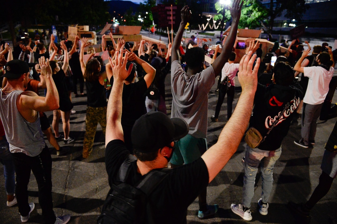 (Francisco Kjolseth  |  The Salt Lake Tribune) People chant "hands up, don't shoot," as demonstrators protest against police brutality in downtown Salt Lake City on Wednesday, June 3, 2020.
