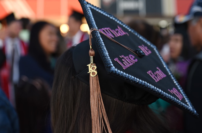 (Francisco Kjolseth  |  The Salt Lake Tribune)  Mackenzie Jensen celebrates with family following University of Utah's 2018 commencement ceremonies on Thursday, May 3, 2018, at the Jon M. Huntsman Center.