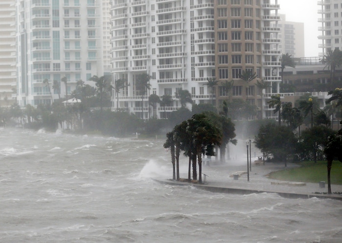 (AP Photo/Wilfredo Lee) Waves crash over a seawall at the mouth of the Miami River from Biscayne Bay, Fla., as Hurricane Irma passes by, Sunday, Sept. 10, 2017, in Miami.