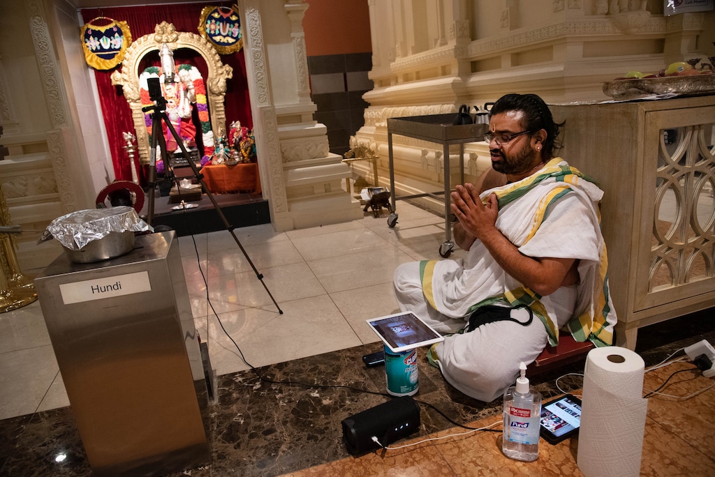 (Francisco Kjolseth | The Salt Lake Tribune) The new tools of ceremony, Hindu priest Sathish Nivarthi keeps Clorox wipes and hand sanitizer close while using multiple screen devices and a camera to broadcast a ceremony live online on Thursday, Sept. 24, 2020, at the Sri Ganesha Hindu Temple in South Jordan. Due to the coronavirus pandemic, the temple remains closed on weekdays with limited time slots available to visit on the weekends in an effort to promote safety.