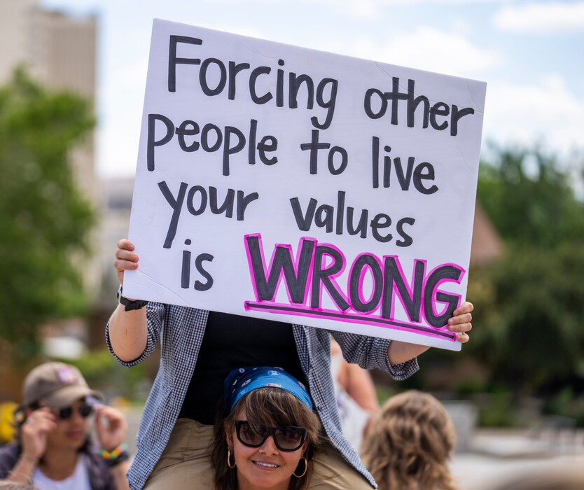 (Rick Egan | The Salt Lake Tribune)  Protesters hold signs as members of Abortion Free Utah and other groups meet at the Capitol to celebrate the end of Roe v. Wade, on Saturday, July 2, 2022.