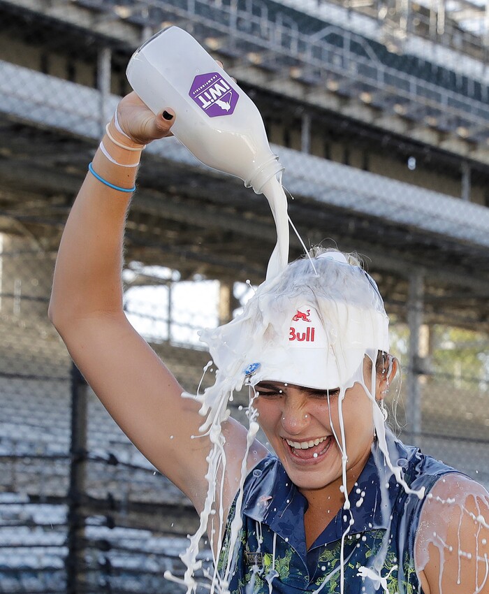 Lexi Thompson pours milk over her head after winning the Indy Women in Tech Championship golf tournament, Saturday, Sept. 9, 2017, in Indianapolis. (AP Photo/Darron Cummings)