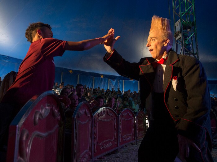 (Rick Egan  |  The Salt Lake Tribune)   Bello Nock high-five's a fan, as he performs with the Big Top Circus Spectacular, at the Utah State Fair, Sunday, September 10, 2017.


