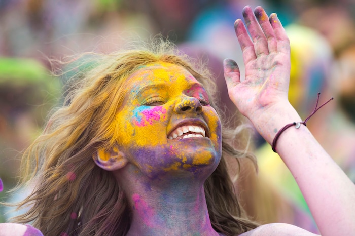 (Rick Egan  |  The Salt Lake Tribune)   Adalaide Bailey, from Pocatello Idaho cheers along with the band, during the Holi Festival of Colors celebration at the Sri Sri Radha Krishna Temple in Spanish Fork, Saturday, March 30, 2019.
 