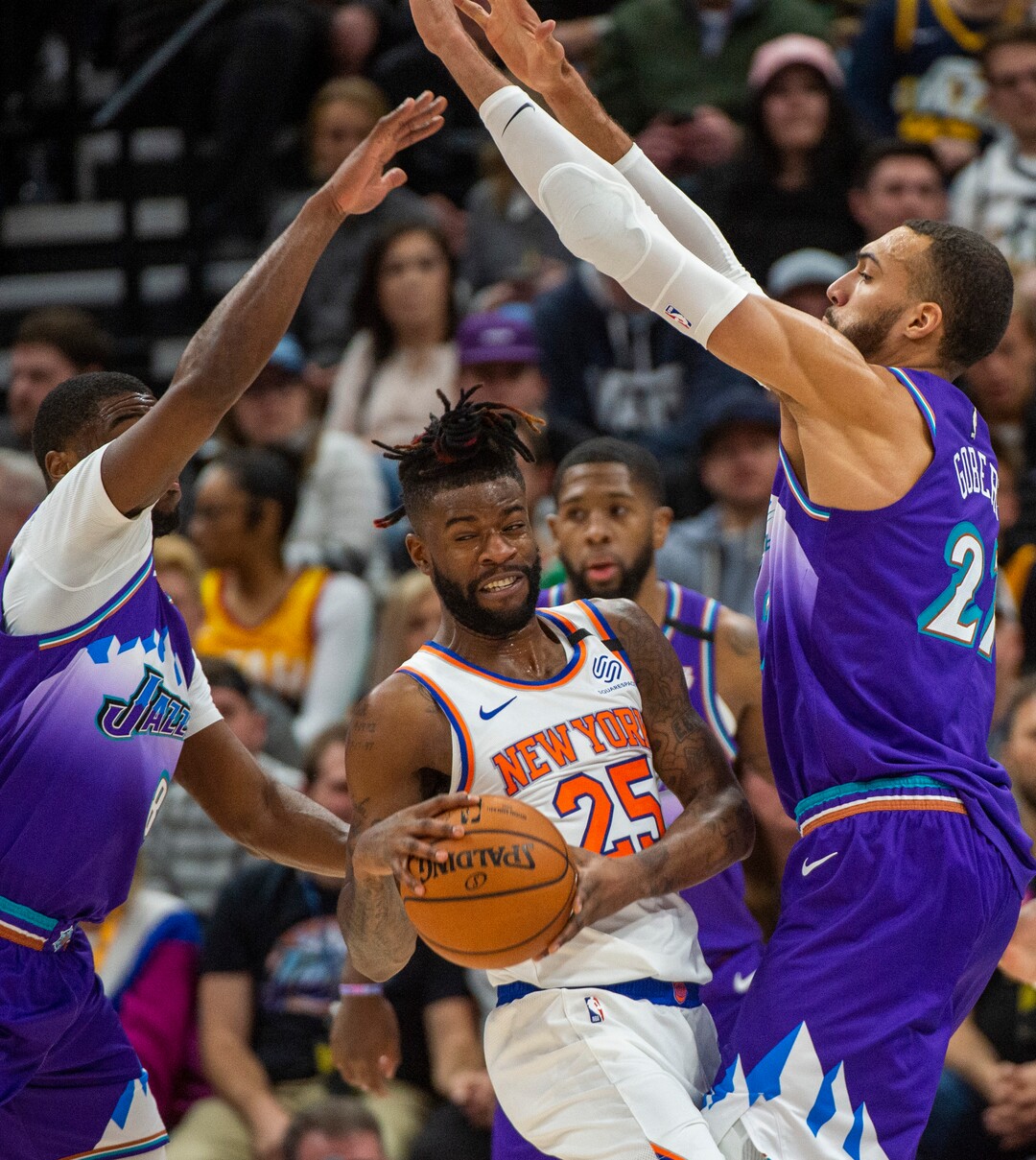 (Rick Egan  |  The Salt Lake Tribune) New York Knicks guard Reggie Bullock (25) is double-teamed by Utah Jazz guard Emmanuel Mudiay (8) and Utah Jazz center Rudy Gobert (27), in NBA action between the Utah Jazz and the New York Knicks, in Salt Lake City, Wednesday, Jan. 8, 2020.