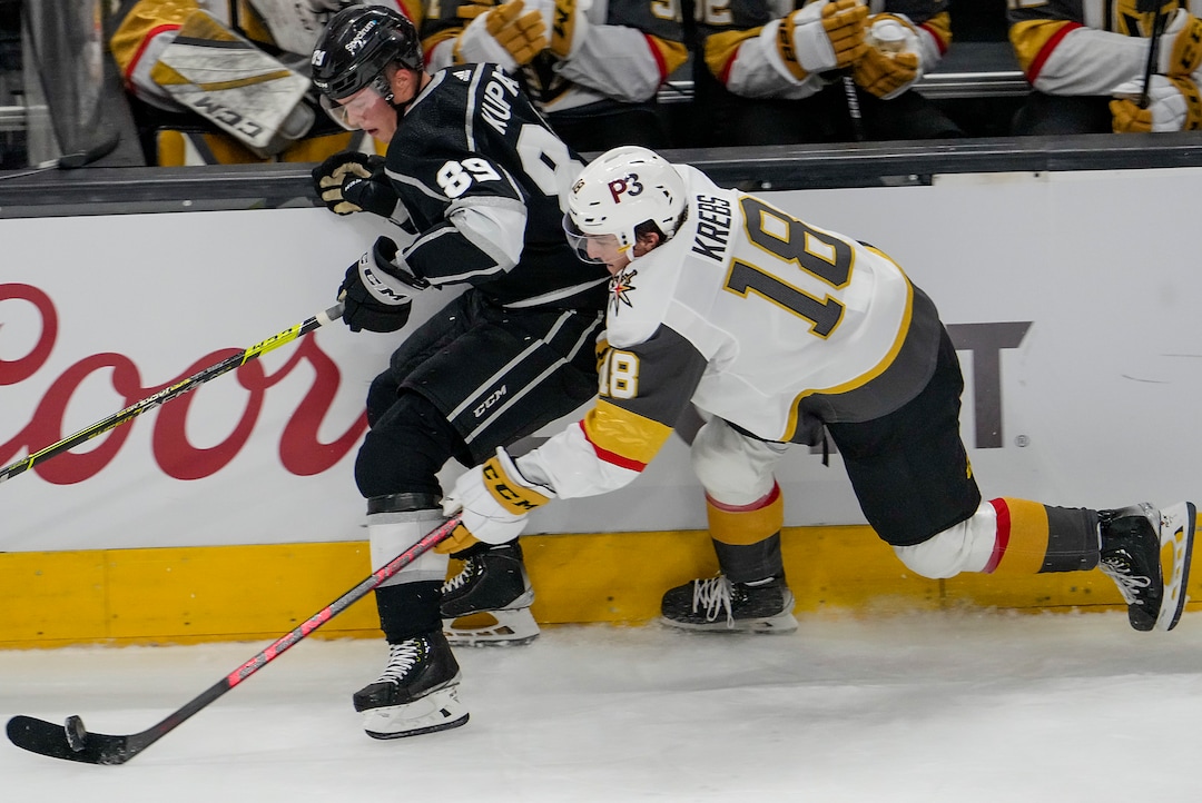 (Leah Hogsten | The Salt Lake Tribune) Vegas Golden Knights left wing Peyton Krebs (18) beats Los Angeles Kings center Rasmus Kupari (89) to the puck as the Los Angeles Kings and Vegas Knights meet in a preseason game at Vivint Arena on Sept. 30, 2021.