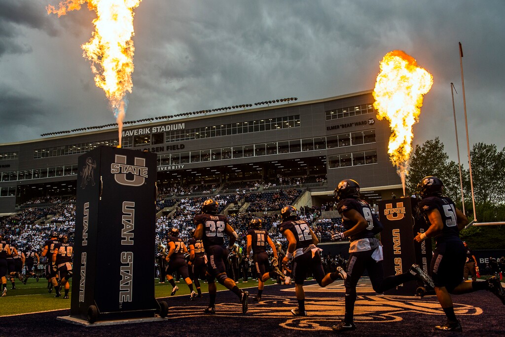 Chris Detrick  |  The Salt Lake TribuneUtah State Aggies run onto the field before the game at Maverik Stadium Thursday September 1, 2016. 